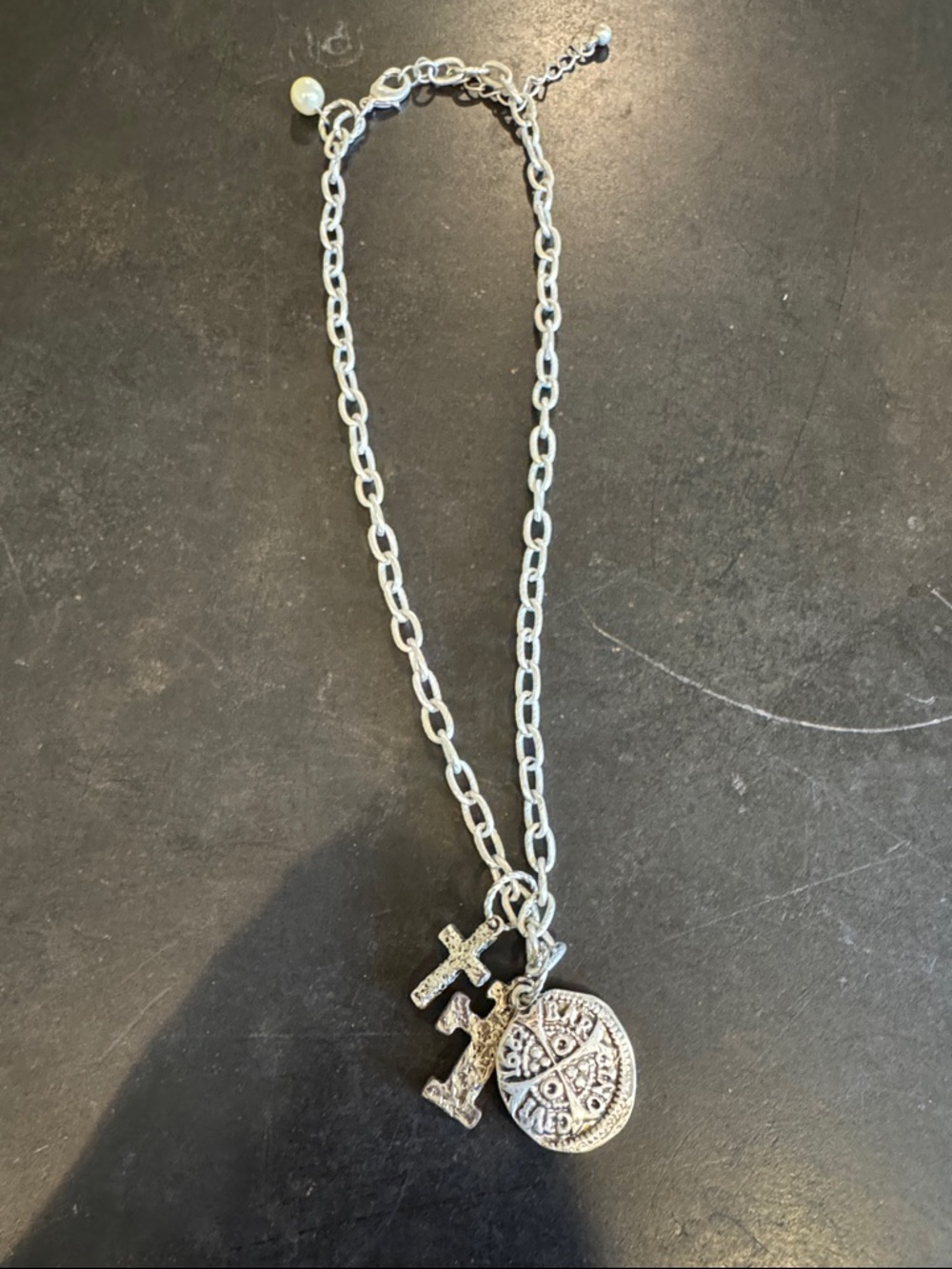 18inch approximately necklace. Silver in color